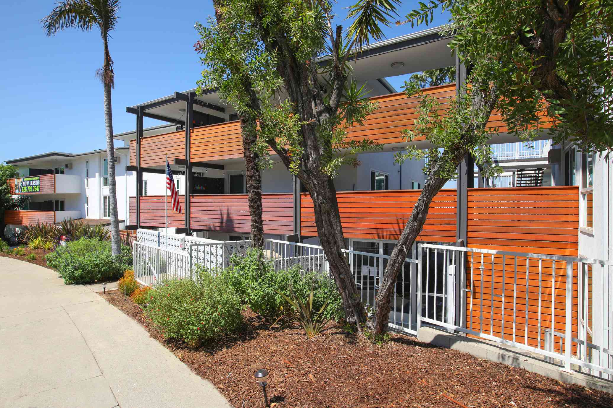 modern exterior with wood accent balconies