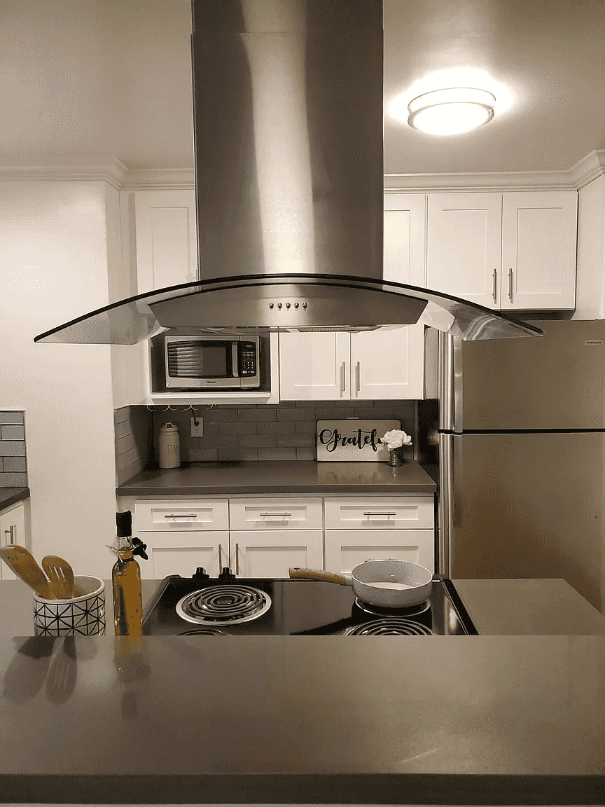 designer glass and stainless range hood