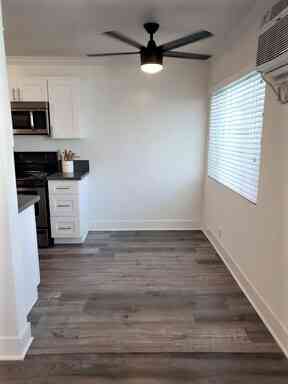 modern dining nook with designer ceiling fan