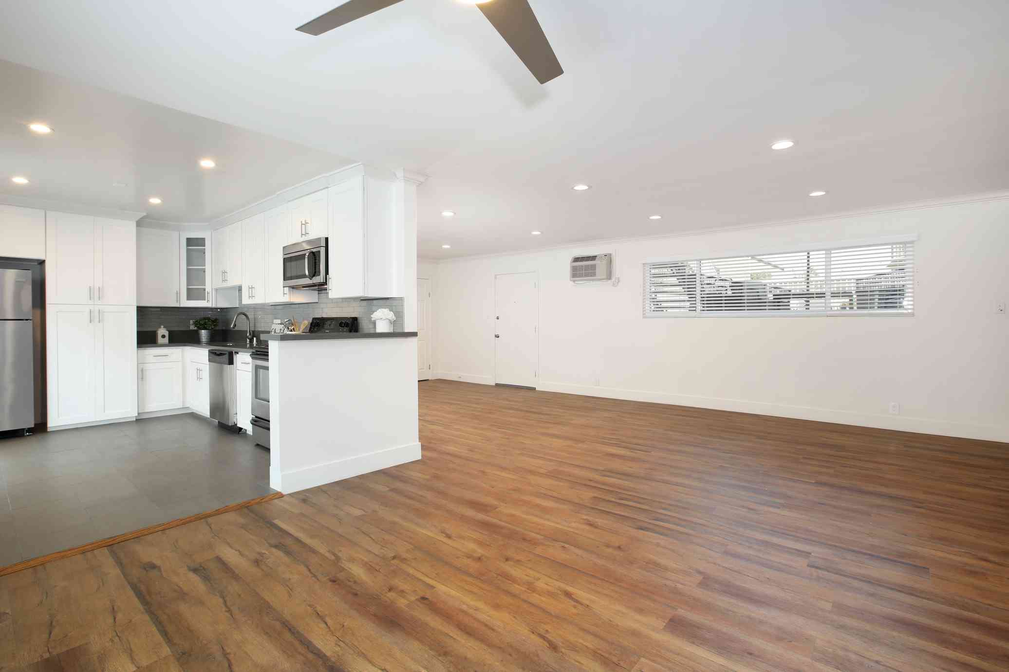 spacious open floor plan with hardwood style flooring
