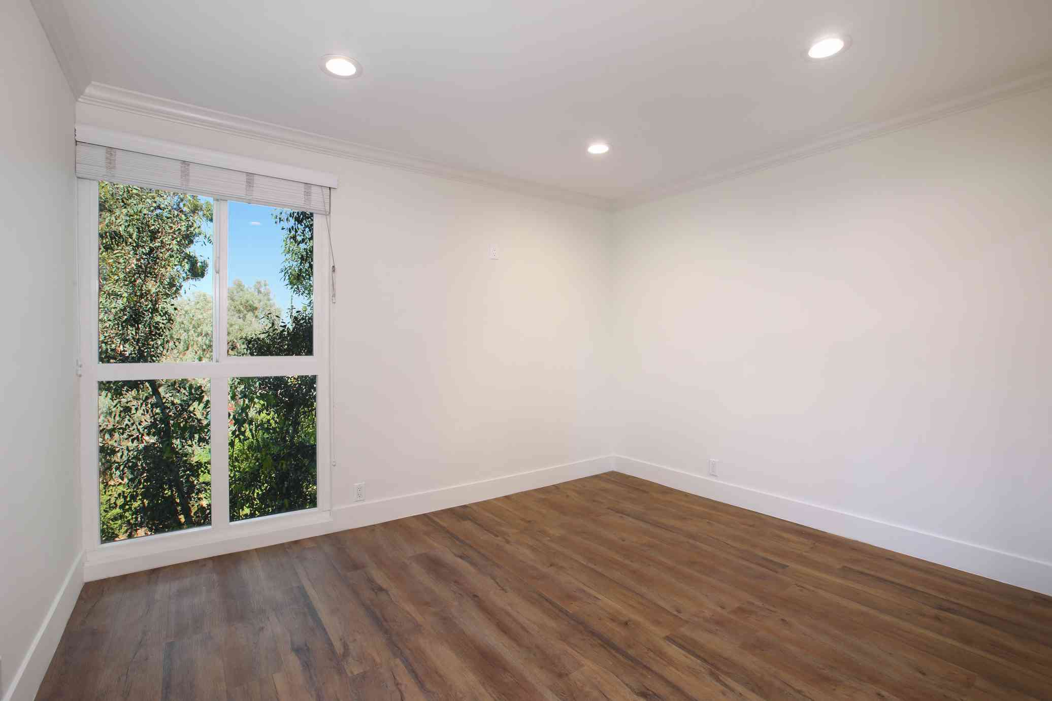 bright bedroom with picture window