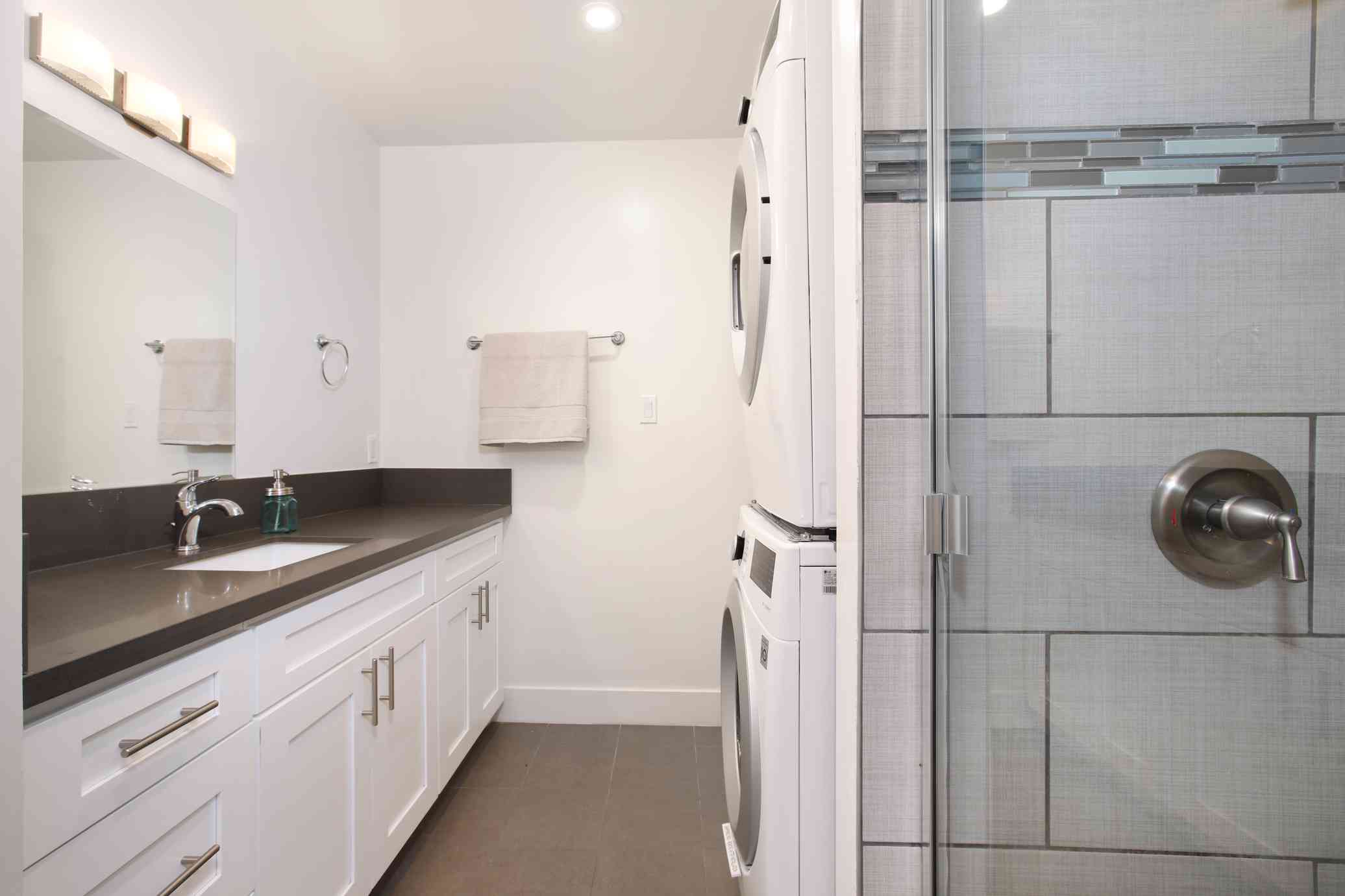 renovated master bath with in unit laundry